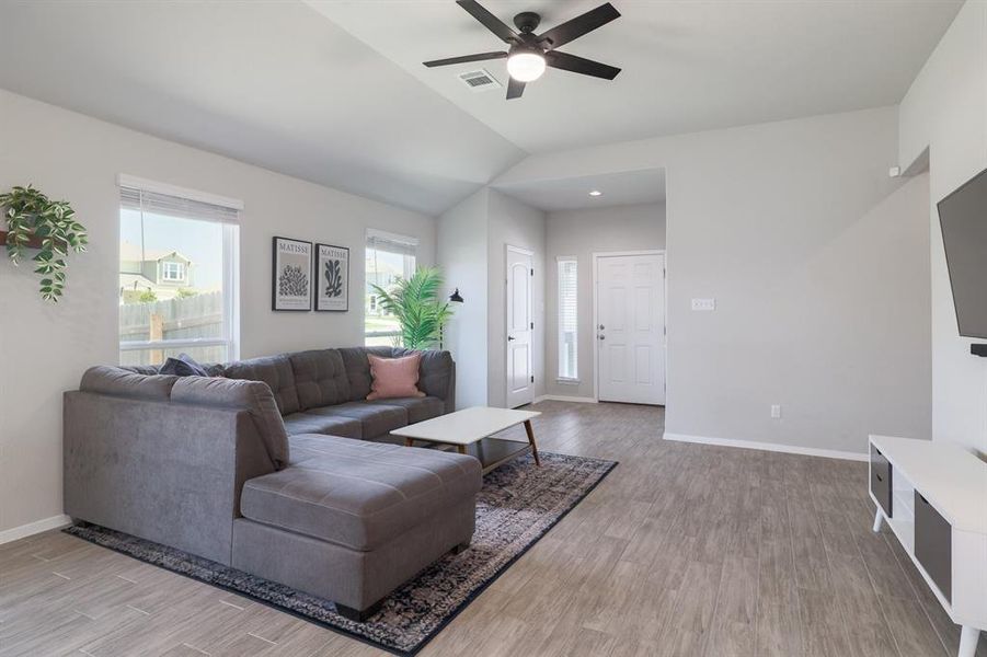 Ceiling fan adds comfort and convenience to the airy living space.