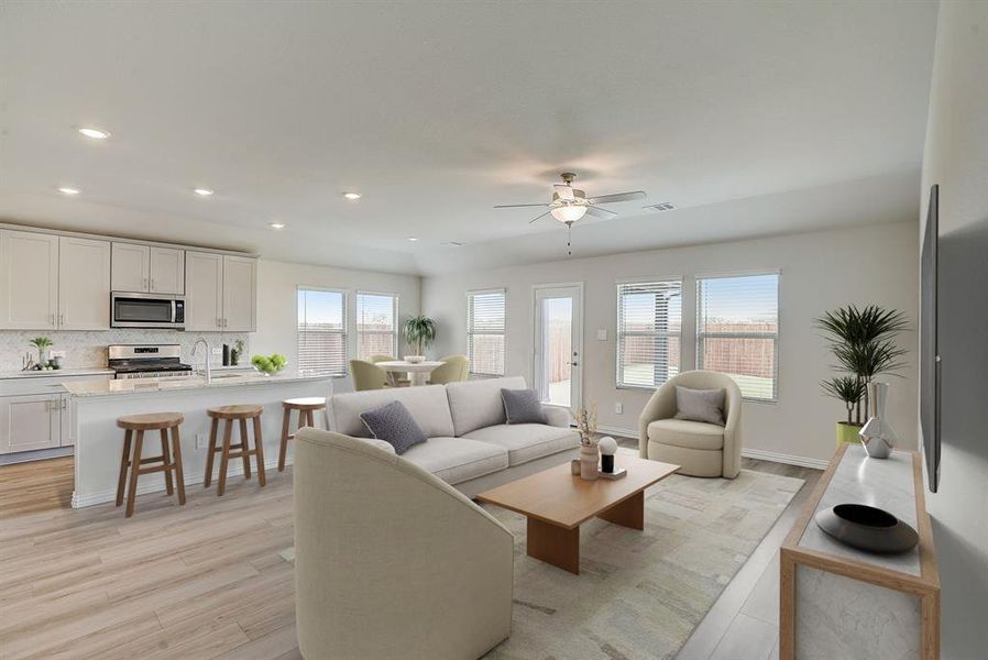 Virtually staged-Living room featuring ceiling fan, light wood-type flooring, and sink