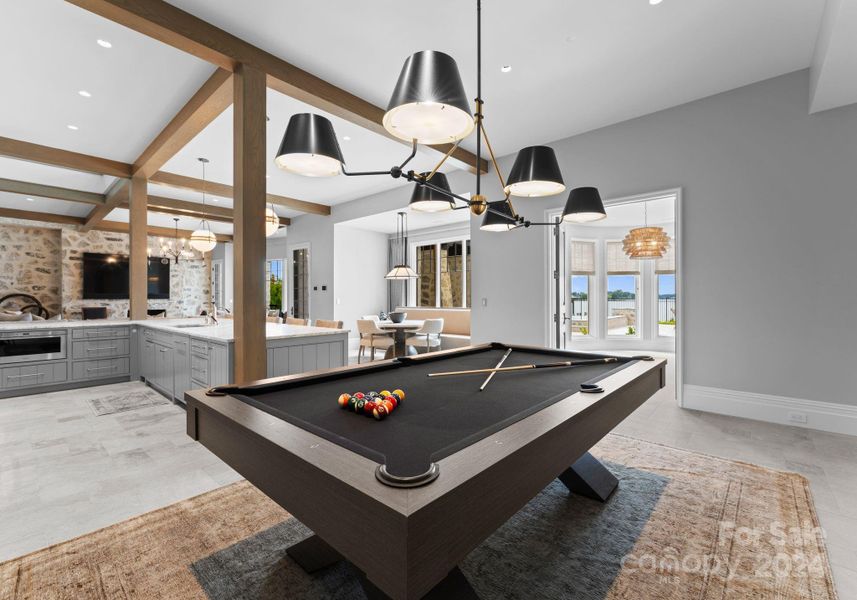 The billiard space is perfectly placed for entertaining in the open concept basement.