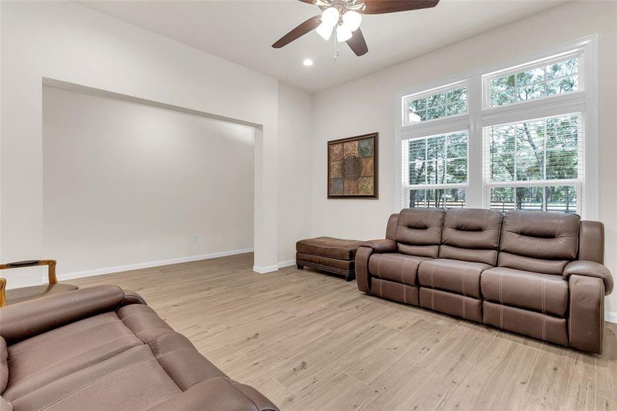 This is a spacious, well-lit living room offering a blank canvas for personalization.