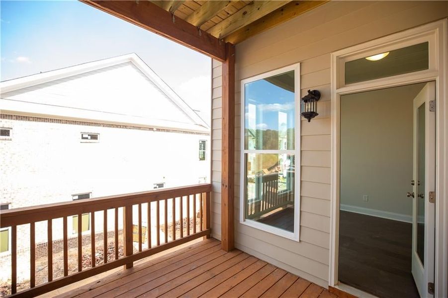 Off sunroom, you will find covered deck - outdoor space above ground level to enjoy!