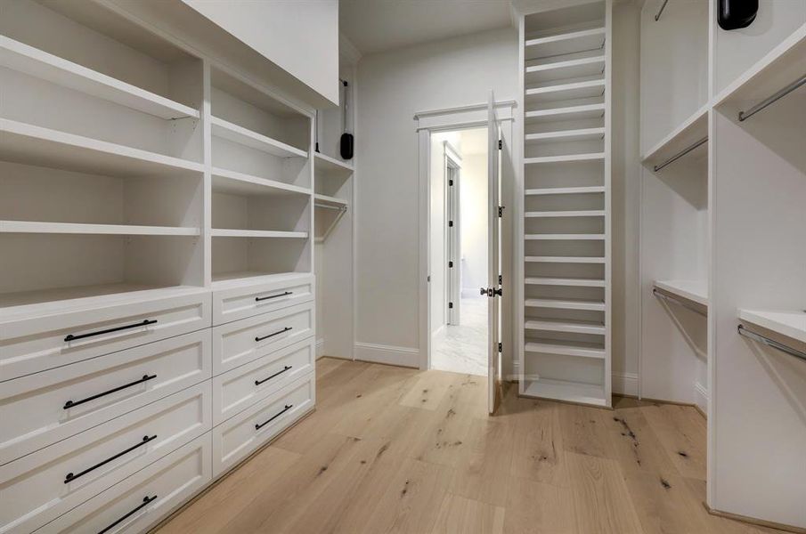 Primary closet with copious built-ins