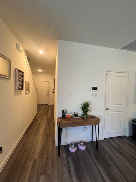 Hall featuring dark hardwood / wood-style flooring