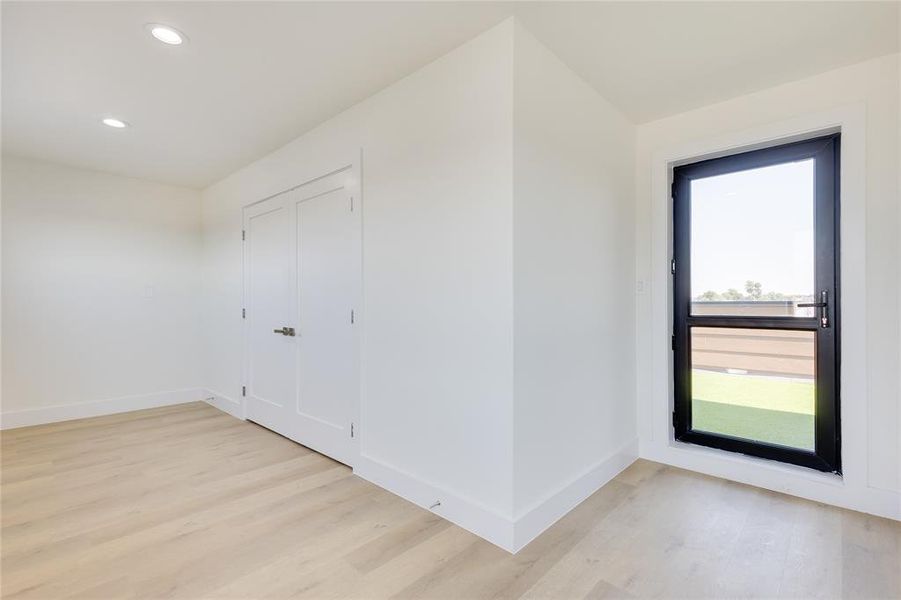 Bonus room with light hardwood / wood-style floors