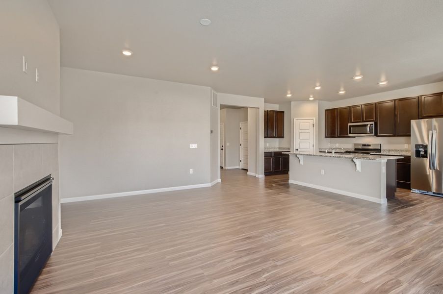 Great room and kitchen of the ranch style Telluride plan by Century Communities