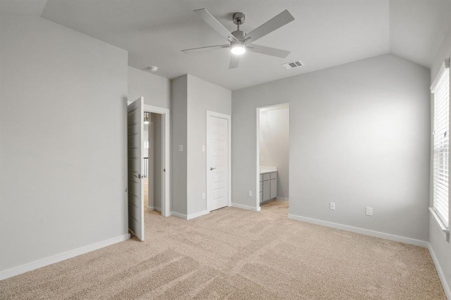 Secondary bedroom features plush carpet, custom paint, large window with privacy blinds and access to the Jack and Jill bath. Sample photo of completed home with similar floor plan. Actual colors and selections may vary.