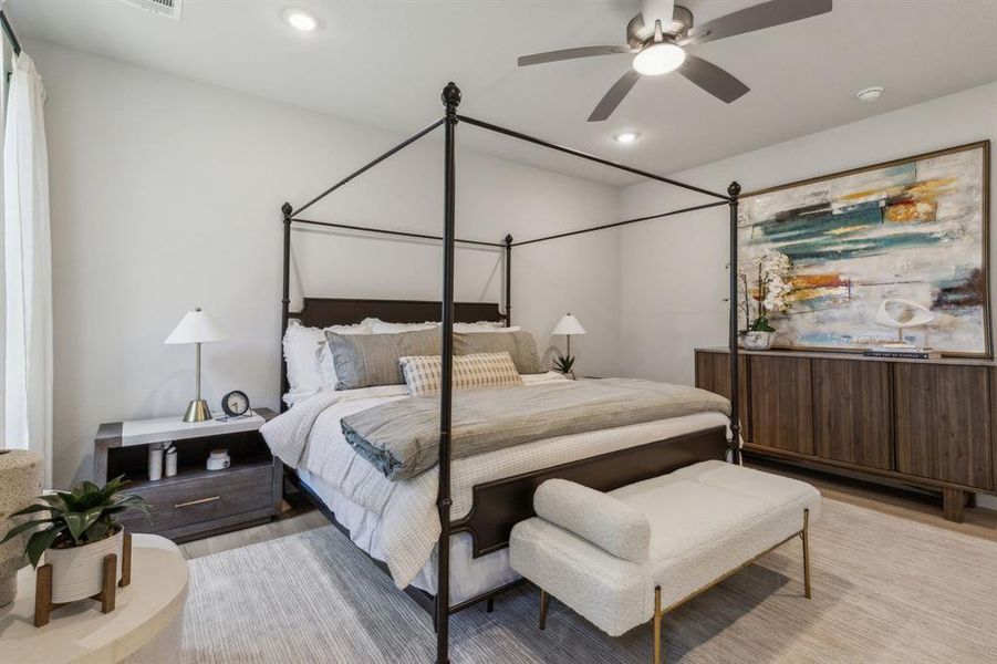 Bedroom with ceiling fan and light wood-type flooring