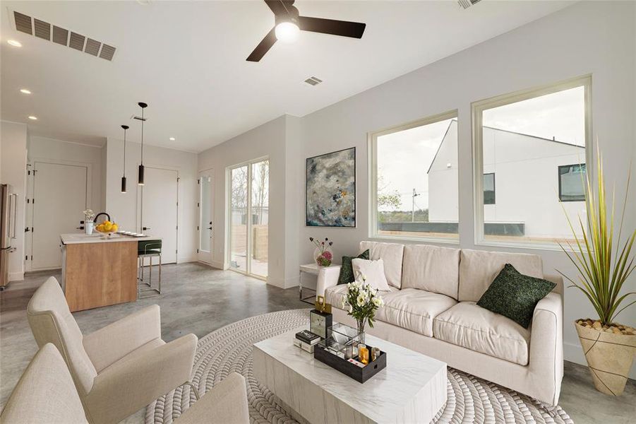 Living room facing kitchen. Virtually staged photo.