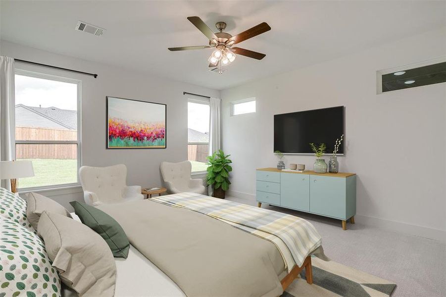 Bedroom featuring ceiling fan and light colored carpet