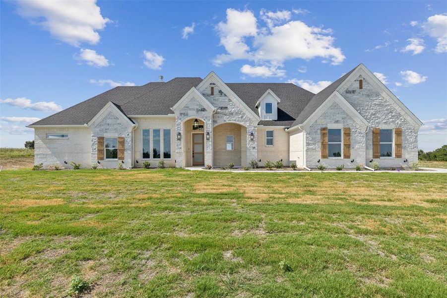 View of front of house with a front lawn