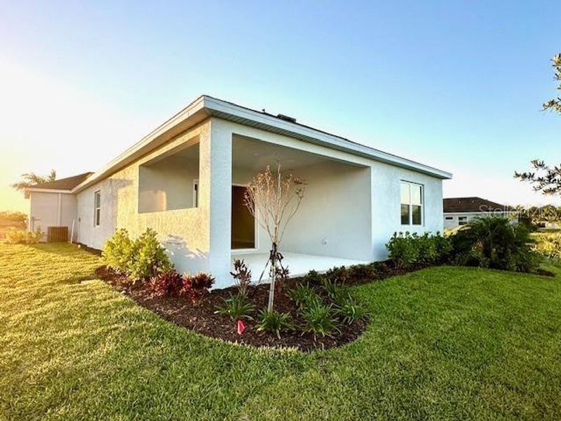 Landscaping surrounds the lanai and back of your new home!