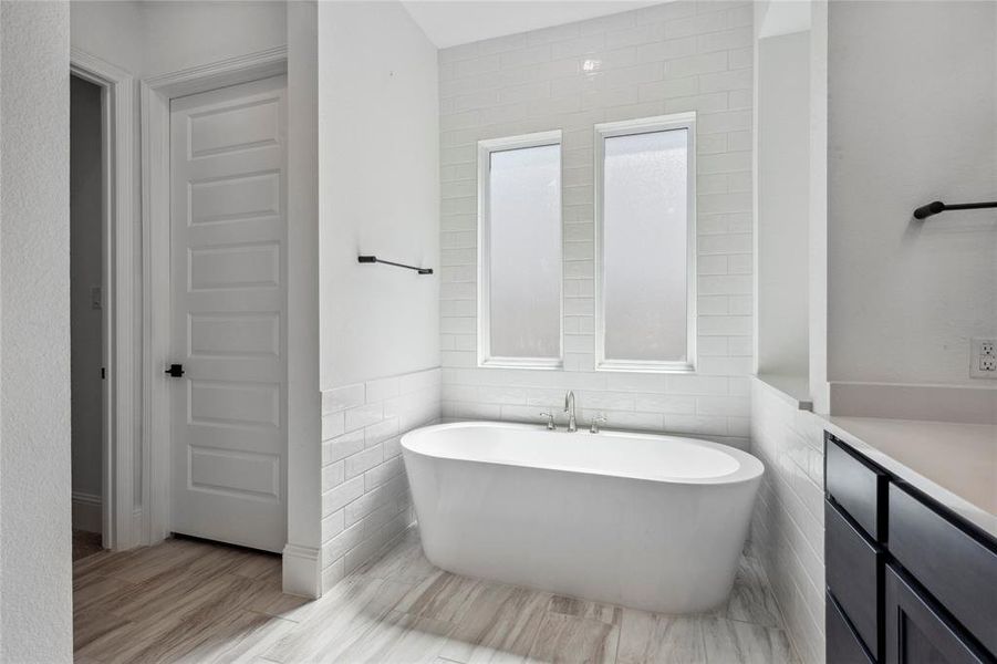 Standalone soaking tub for relaxation awaits!