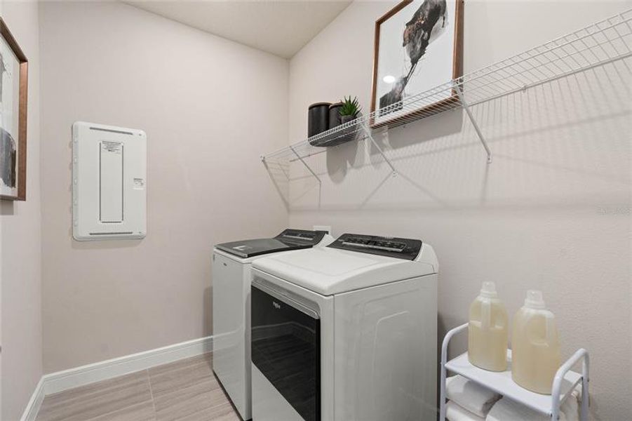 Laundry Room.  Model Home Design. Pictures are for illustrative purposes only. Elevations, colors and options may vary. Furniture is for model home staging only.