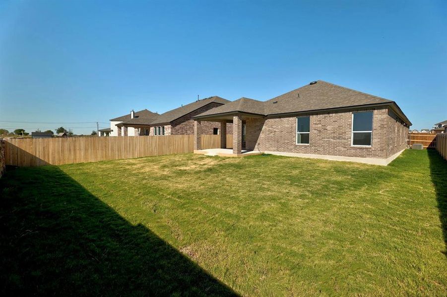 Spacious backyard, perfect for outdoor gatherings and enjoying the natural surroundings.