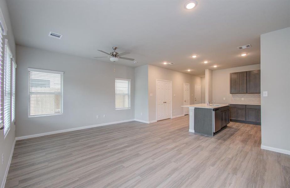 Open concept kitchen/dining living area located on first floor