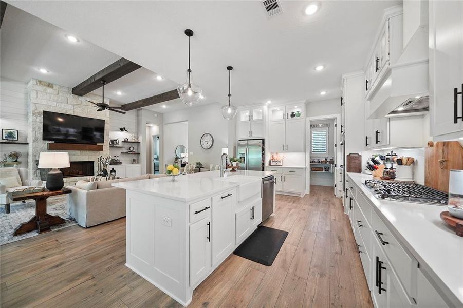 This immaculate kitchen has tons of countertop space for easy meal prep and clean up. With a large walk-in pantry and ample cabinetry, you will have plenty of room for all your favorite kitchen gadgets here.
