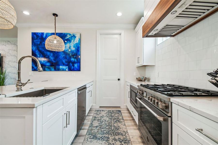 Kitchen with walk-in pantry.