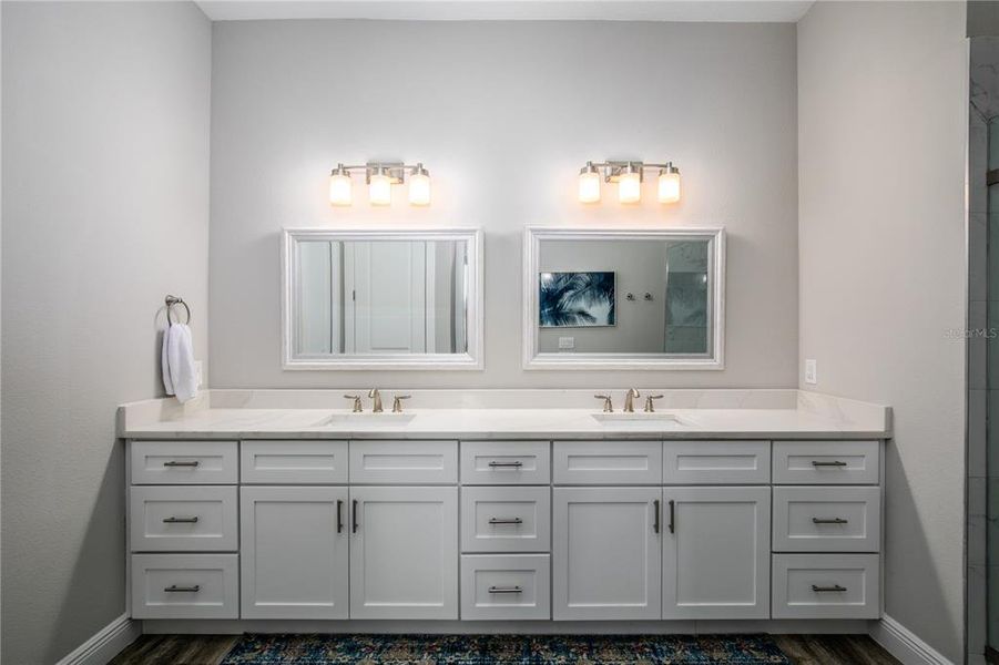 Ensuite bath quartz-topped vanity and soft-close cabinetry.