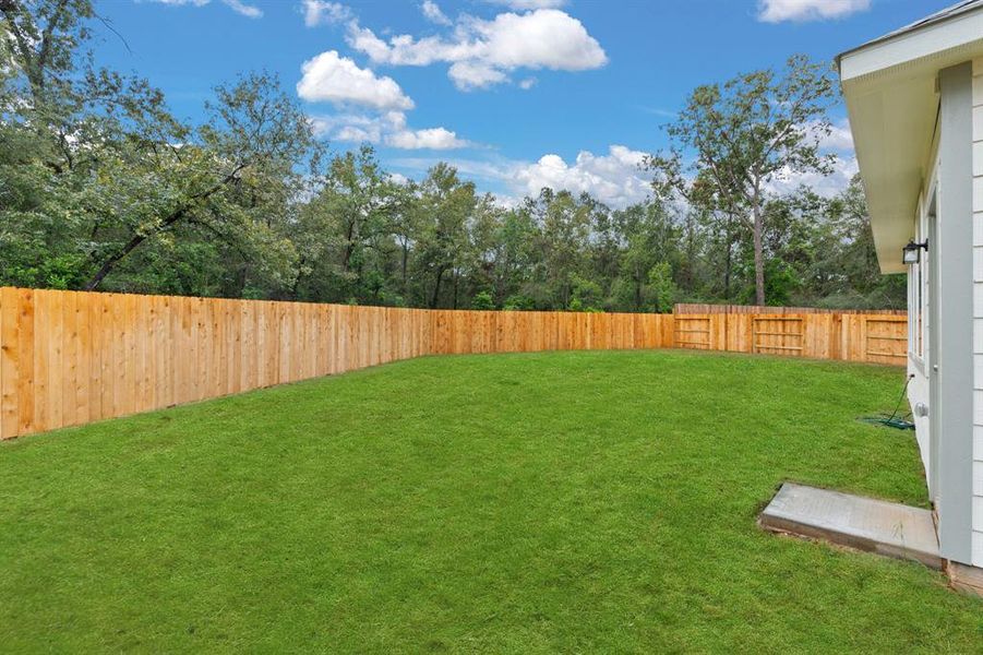 This backyard is perfect for family gatherings, social events, or simply unwinding in the fresh air.