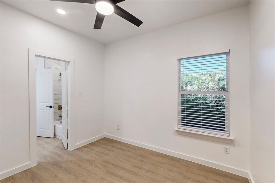 Unfurnished room featuring ceiling fan and light hardwood / wood-style floors