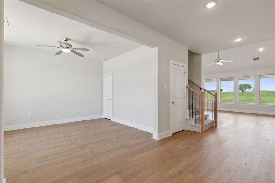 Unfurnished room featuring light hardwood / wood-style flooring and ceiling fan