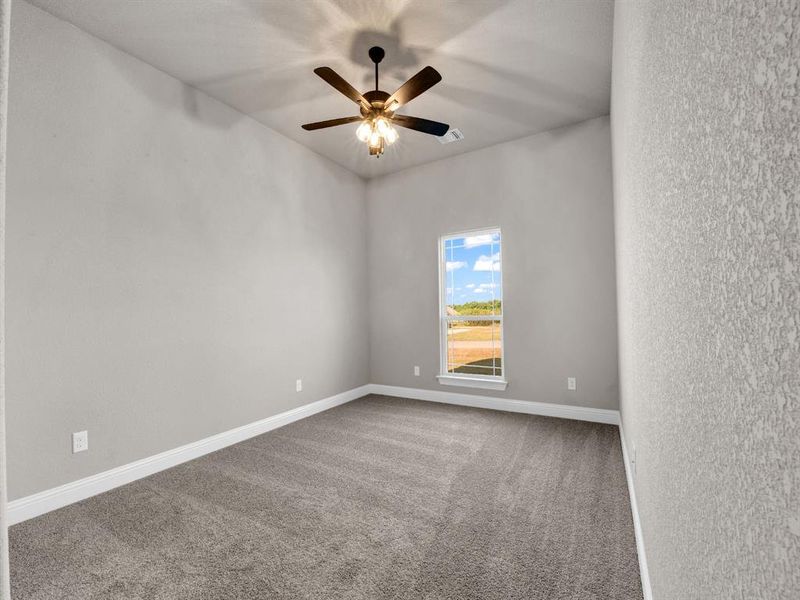 Unfurnished room with carpet floors and ceiling fan