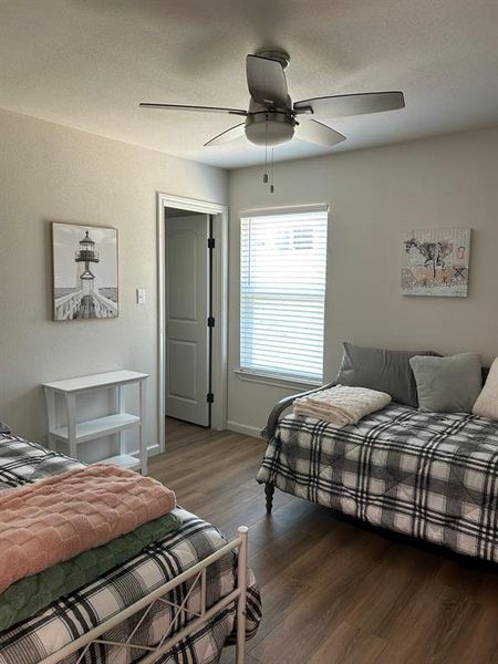 Bedroom with hardwood / wood-style flooring and ceiling fan