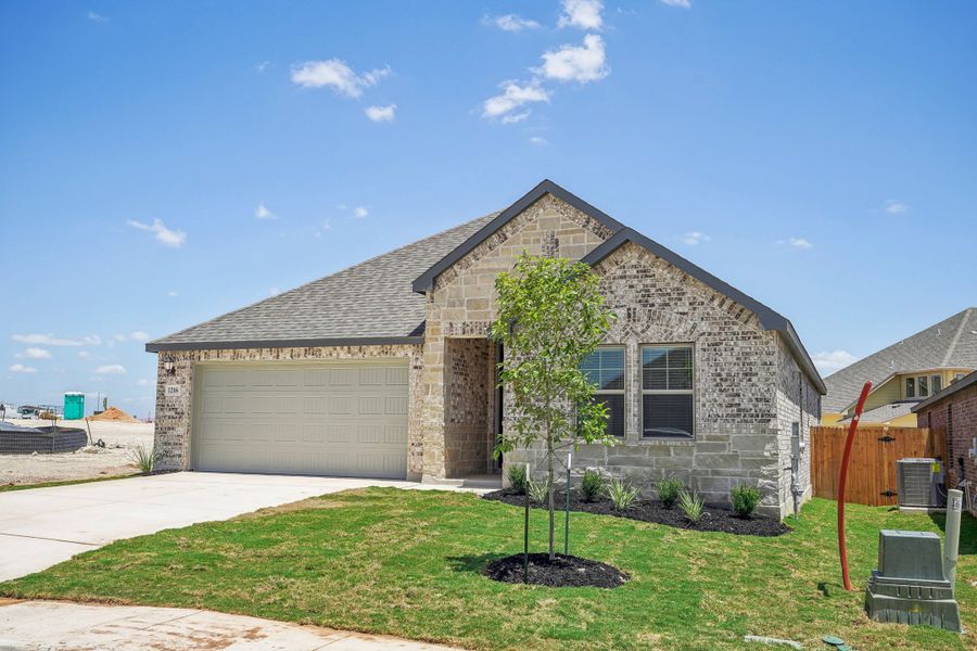 Front exterior of the Fitzhugh floorplan at a Meritage Homes community.