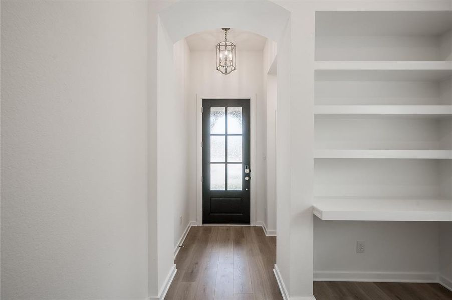 Foyer with chandelier.