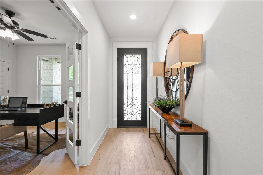 Foyer featuring light hardwood / wood-style flooring and ceiling fan