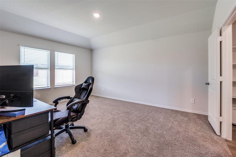 Home office featuring carpet