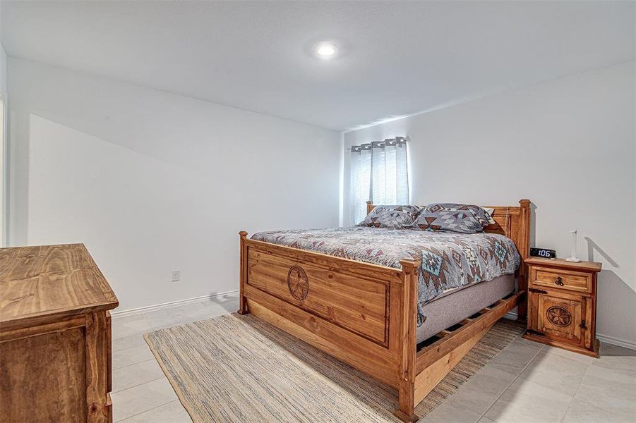 Bedroom featuring light tile patterned floors