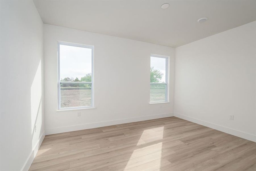 Spare room with light hardwood / wood-style flooring