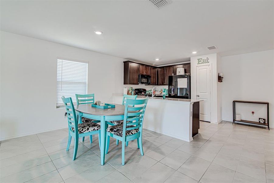 Dining area featuring light tile patterned flooring