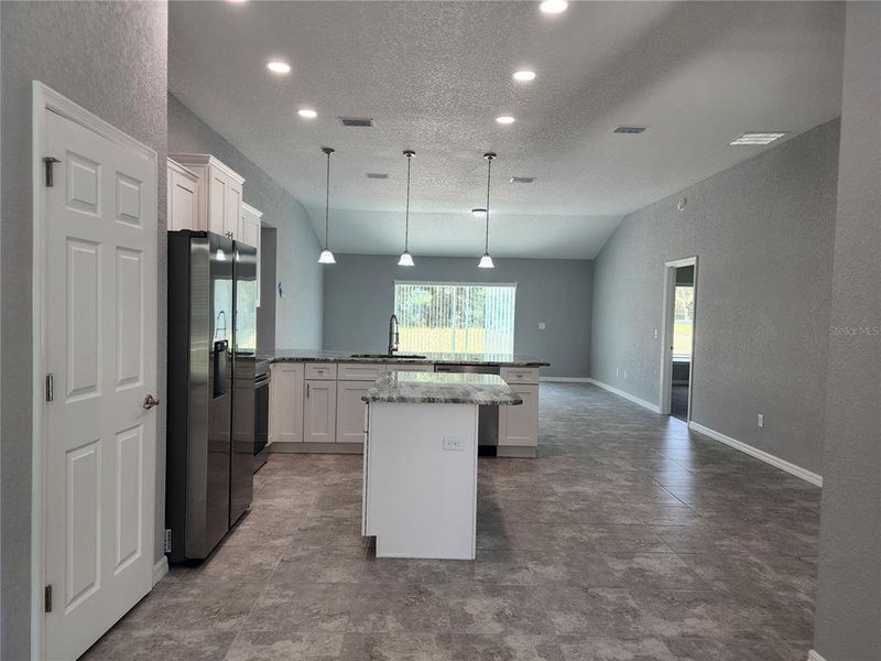 Kitchen with an island and built-in pantry