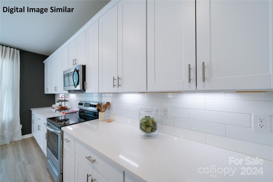 Digital Image Similar: Kitchen also features upgraded backsplash, actual does not have under cabinet lighting