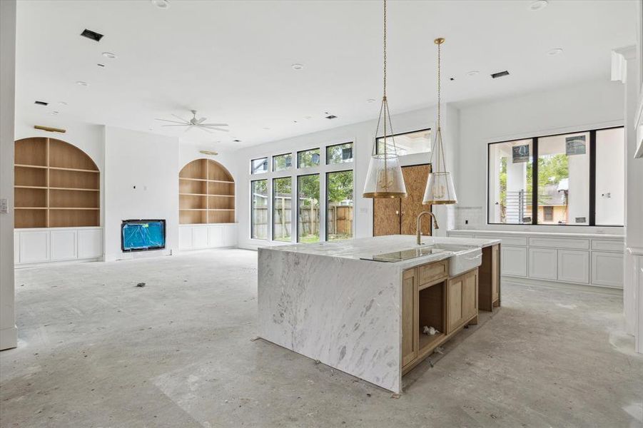 A view toward the living room from the kitchen.  The backyard views from every corner of this space are amazing.  Soon to come, custom double steel glass doors for backyard access.  Photo as of 9/3/2024