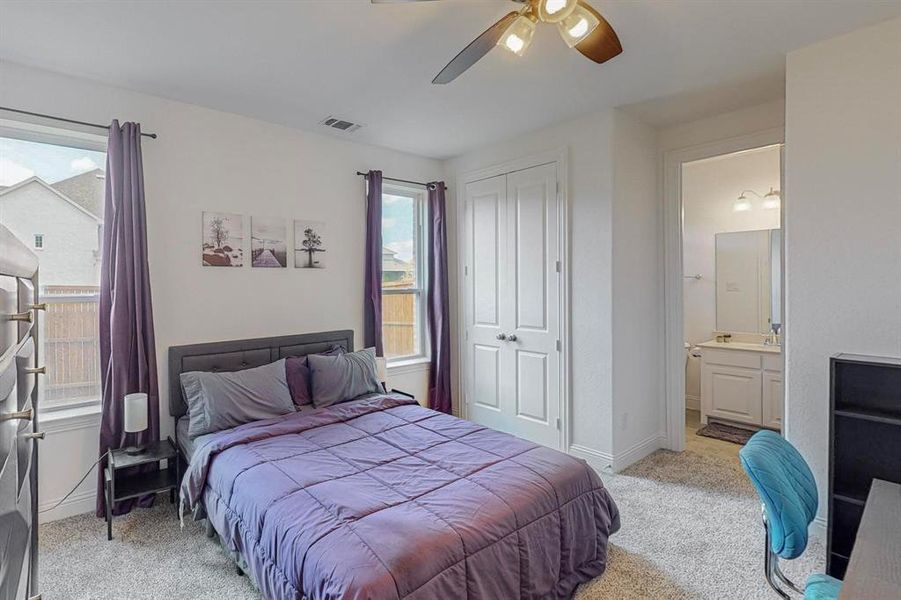 This Bedroom with Ensuite Bathroom is located on the opposite side from the Primary towards the laundry and garage. It provides an abundance of natural light and can function as a guest suite.