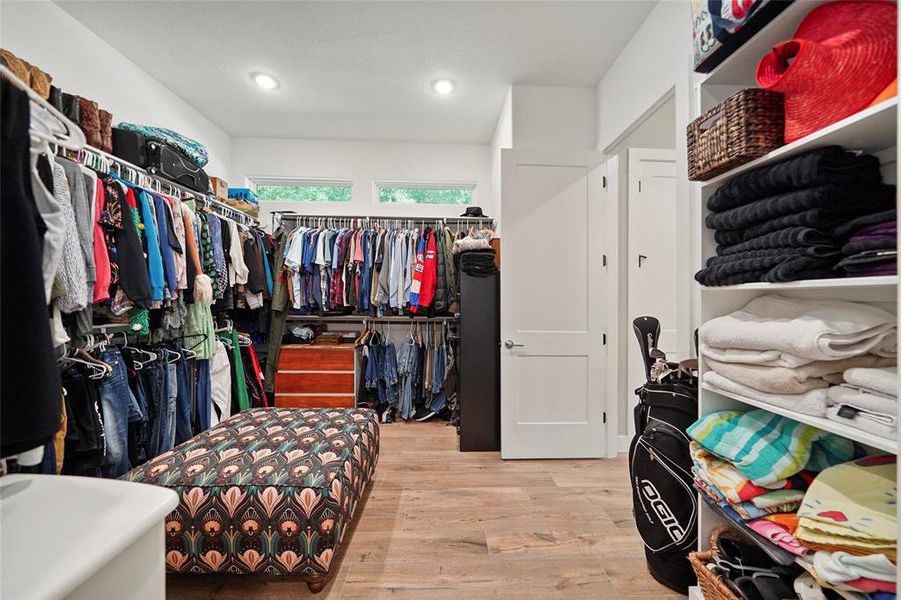 Shop until you drop! This massive walk-in closet in the primary suite can take it. Also notice, it's conveniently attached to the utility room as well.