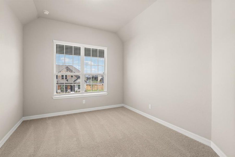 Your secondary bedroom features plush carpet, fresh paint, closet, and a large window that lets in plenty of natural lighting.