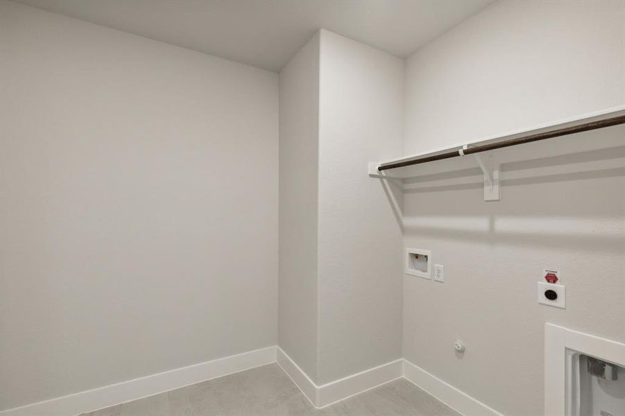 Laundry room featuring washer hookup, hookup for an electric dryer, and hookup for a gas dryer