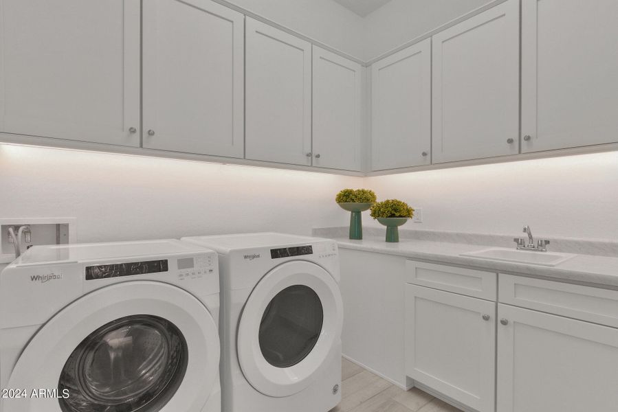 Spacious Laundry room with cabinets