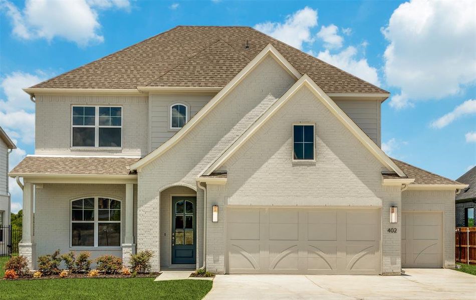 View of front of property with a garage