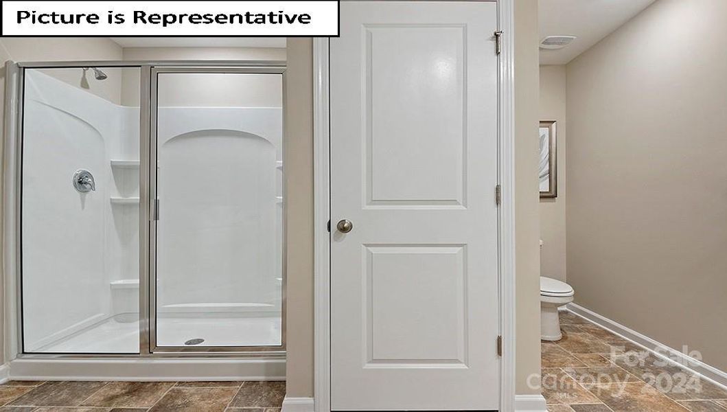 Primary Bathroom with large shower and linen closet