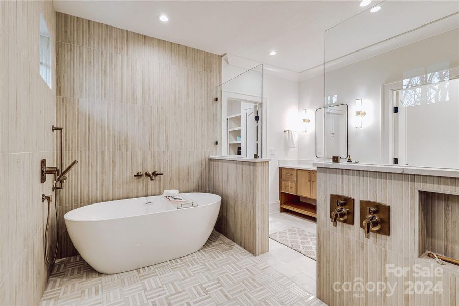 Gracious shower / tub area in primary bathroom