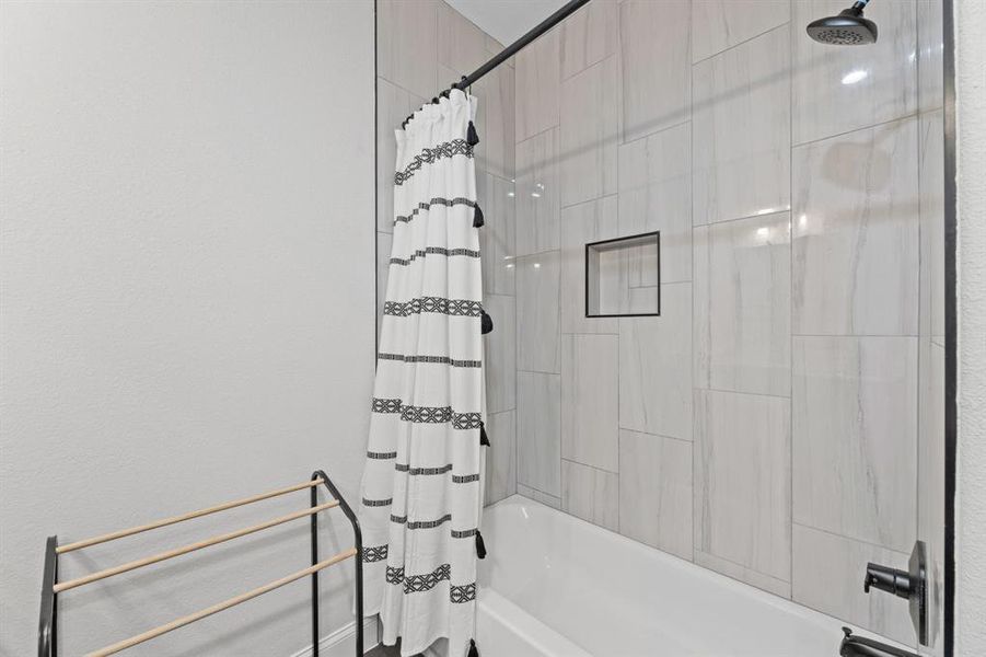 Bathroom featuring shower / bath combo