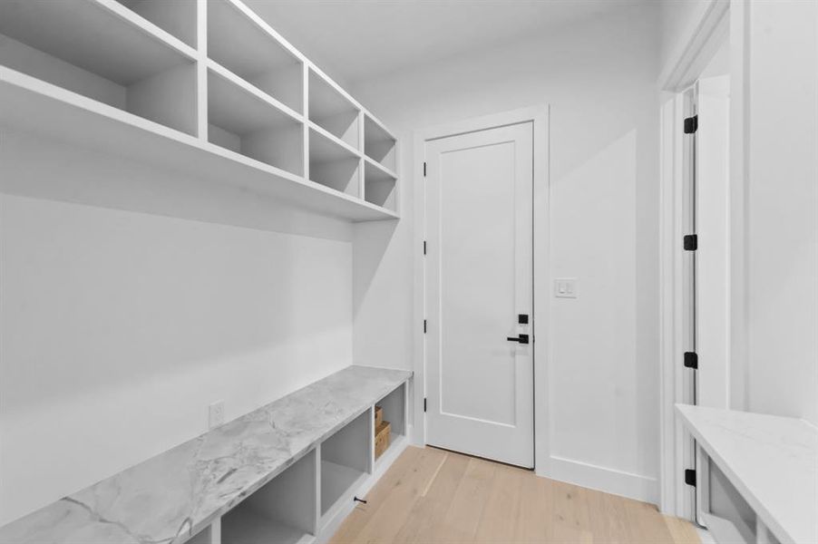 Mudroom with light wood-type flooring