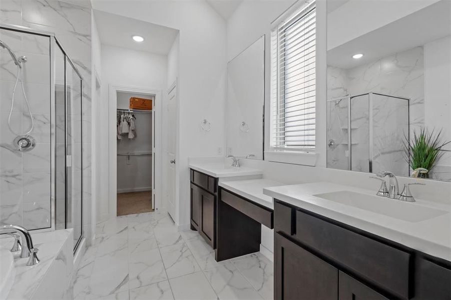 Gorgeous en-suite bathroom with walk in shower, garden tub and double vanities. Large walk in closet.