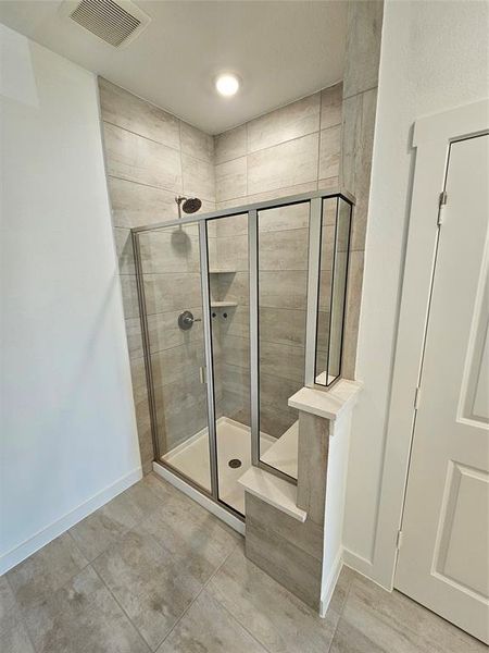 Ensuite master bath separate glass-enclosed shower