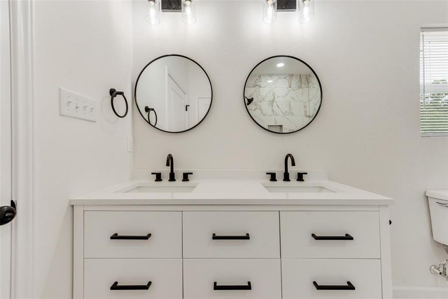 Bathroom with vanity and toilet